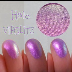 Close-up of multichrome eyeshadows shifting between emerald, violet, and bronze hues in compact palette