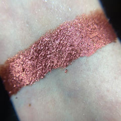 Close-up of Gravity Eye Shadow Palette showing twelve vibrant matte and shimmer shades in circular pans