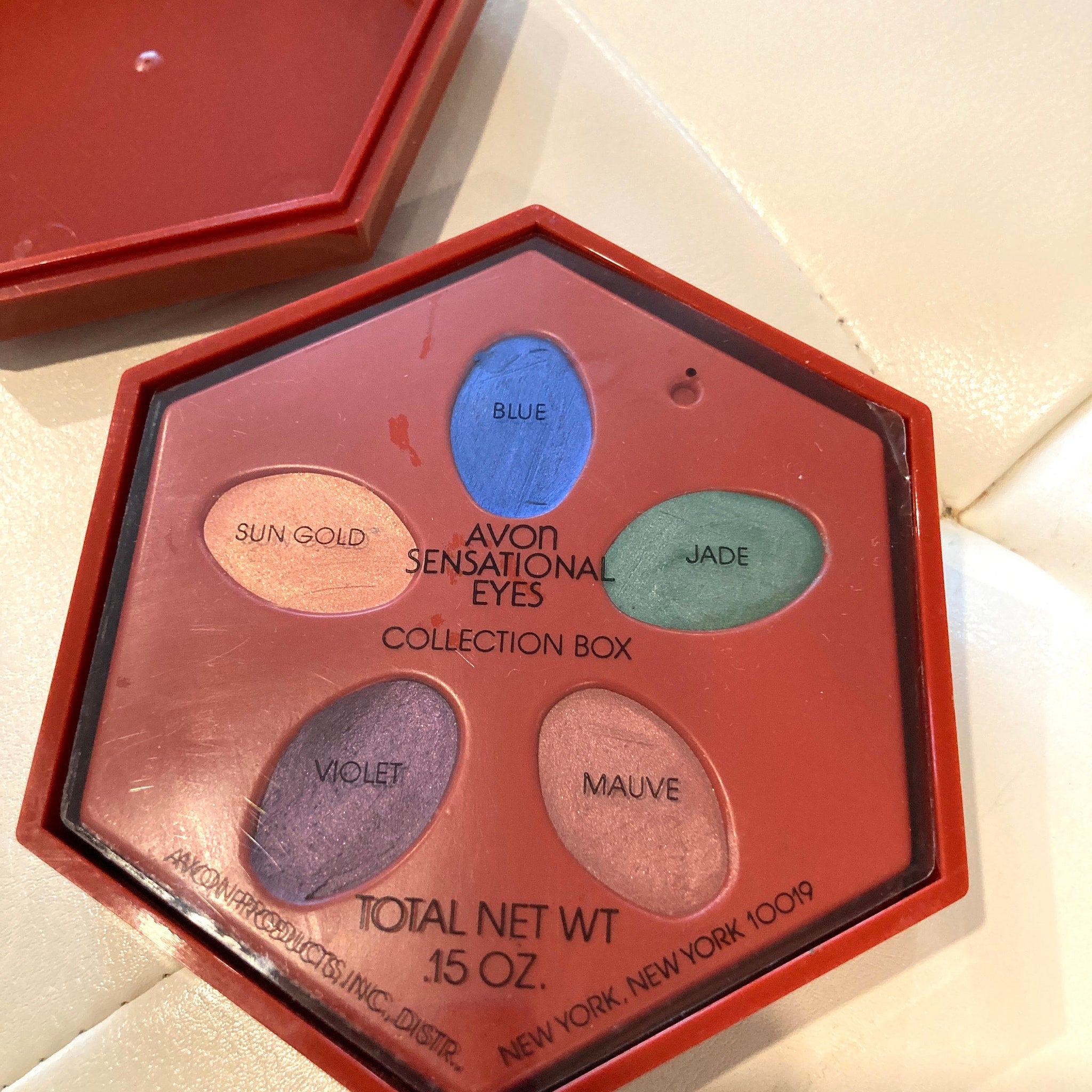 Side view of Avon Sensational Eyes Vintage Collection Box showing stacked eye shadow pans in neutral tones
