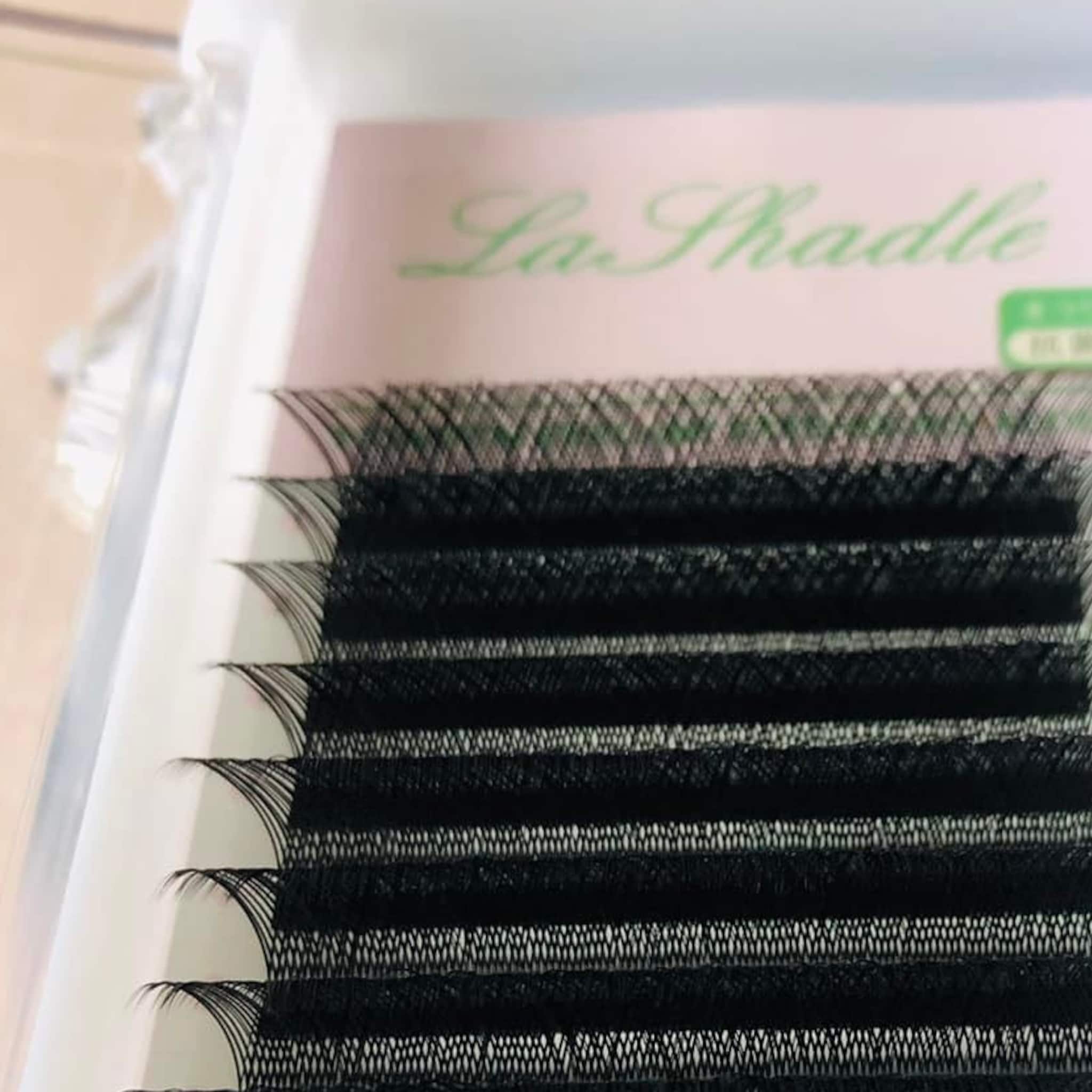 False eyelashes, black synthetic material, curved style, LaShadle brand name visible