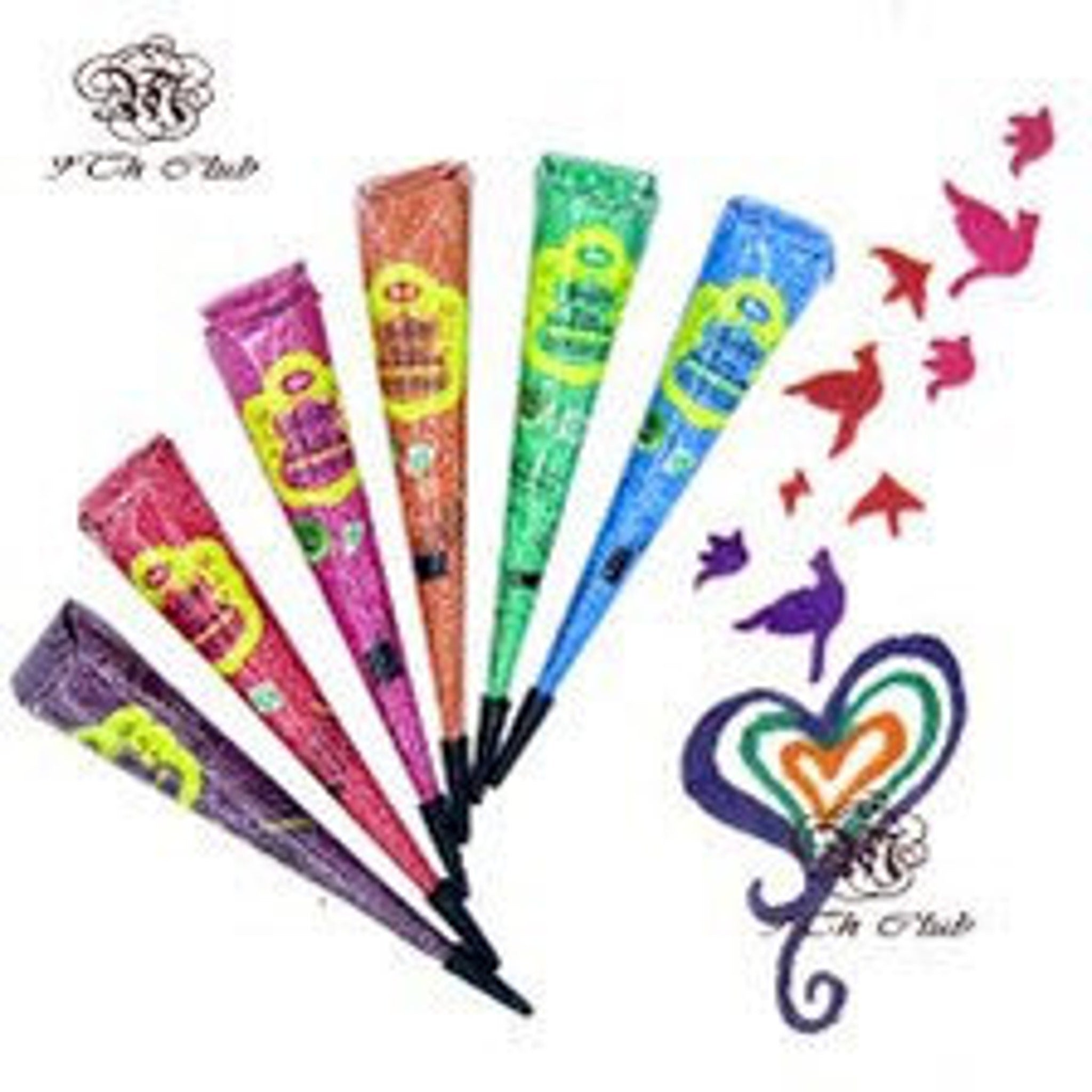 Six vibrant vegan henna paste cones in purple, red, magenta, orange, green, and blue arranged diagonally on marble surface