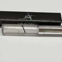 Lip gloss tube with silver metallic cap and clear tube, Monet brand visible on tube and box