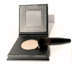Close-up of barely bisque eyeshadow compact showing smooth matte finish and refillable paperboard case design