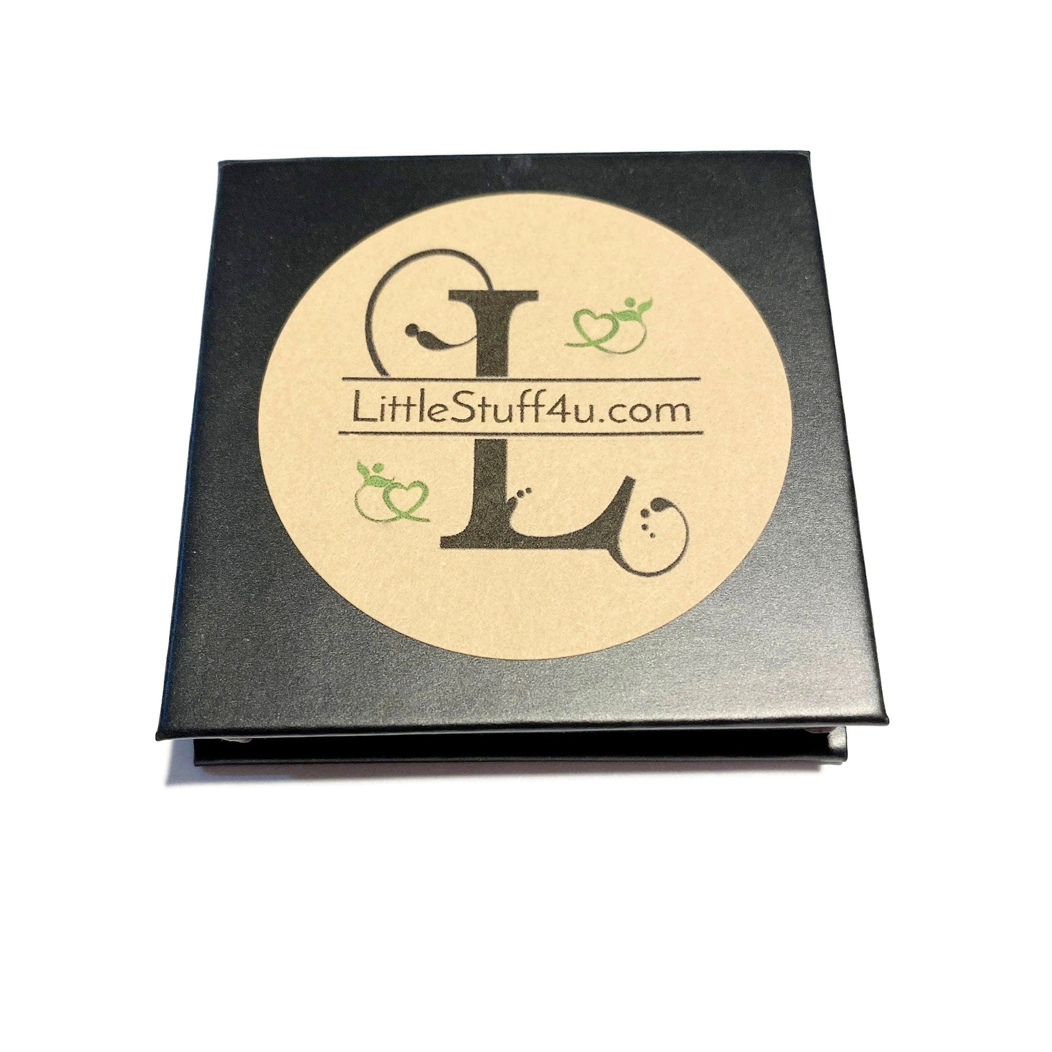 Side view of Day Dream pressed mineral eye shadow compact showing smooth matte finish and neutral beige tone