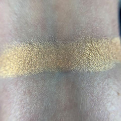 Side view of May Eyeshadow palette showing gradient of shimmering bronze to copper shades in rectangular compact