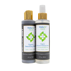 Facial cleanser and toner bottles, black and white with gold caps, VitaliaMD brand
