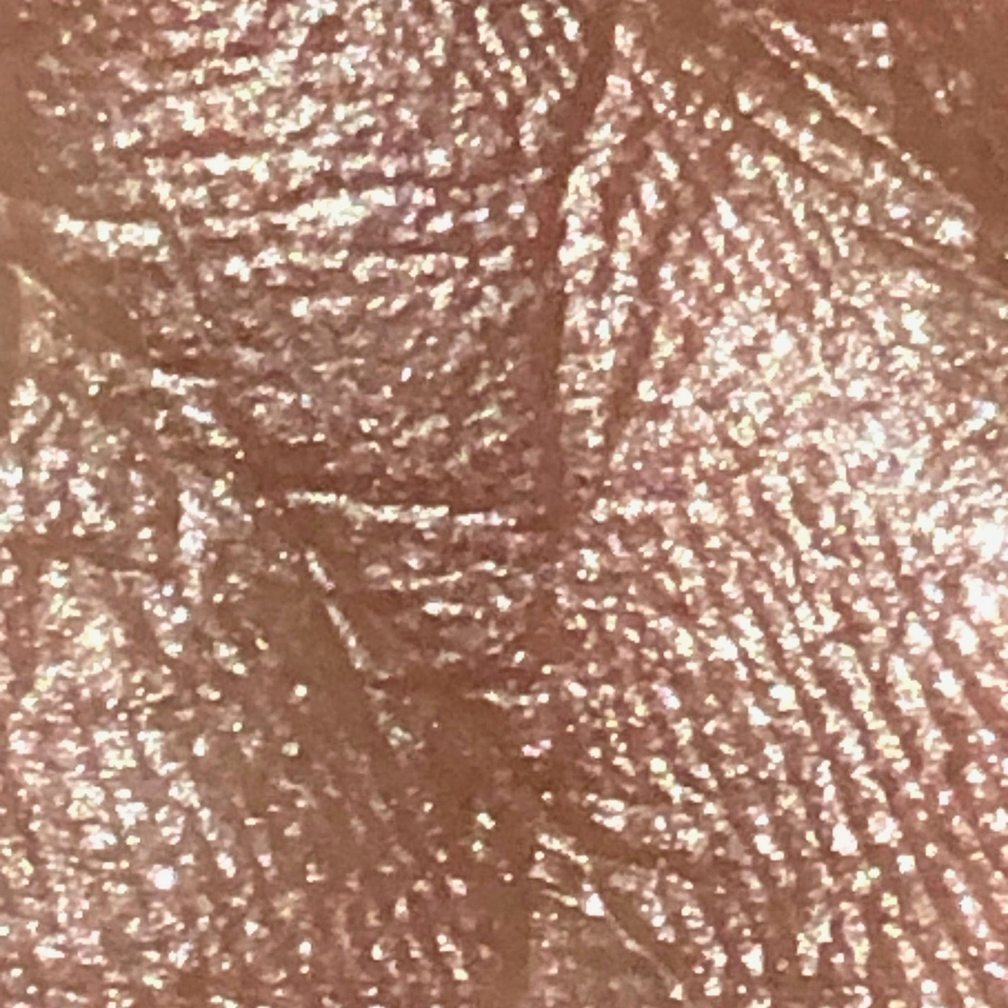 Close-up of fingertips applying shimmering silver moon eyeshadow to eyelid crease