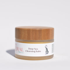 Cleansing balm jar with wooden lid, glass jar, and Coral Skin Co. label