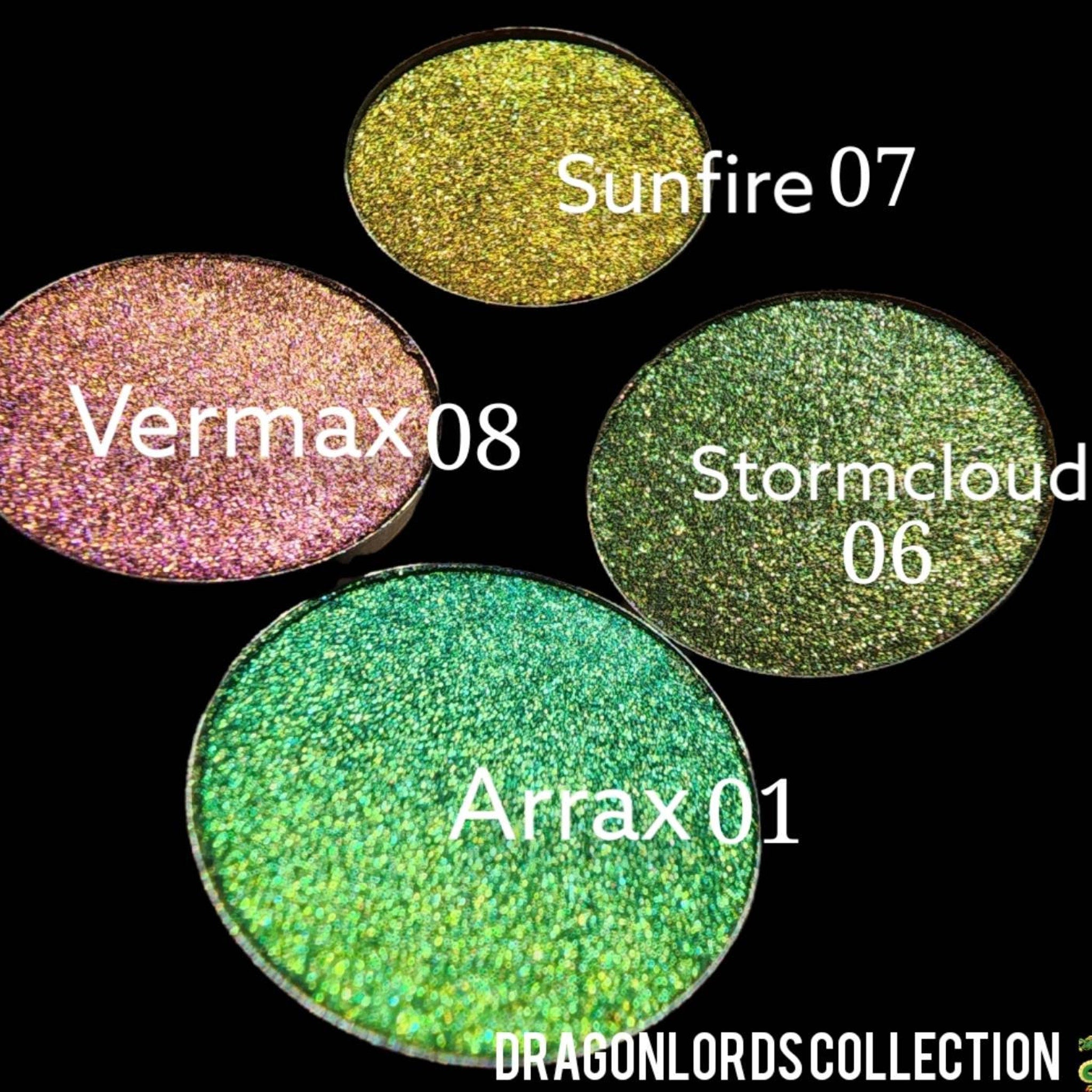 Eyeshadow pans with glitter in various colors, DRAGONLORDS COLLECTION text visible