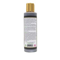 Charcoal cleanser bottle with gold cap, gray and black label, standing upright