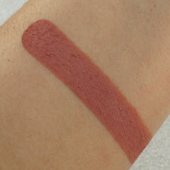 Lipstick swatch, matte finish, dusty rose color on skin, for color comparison