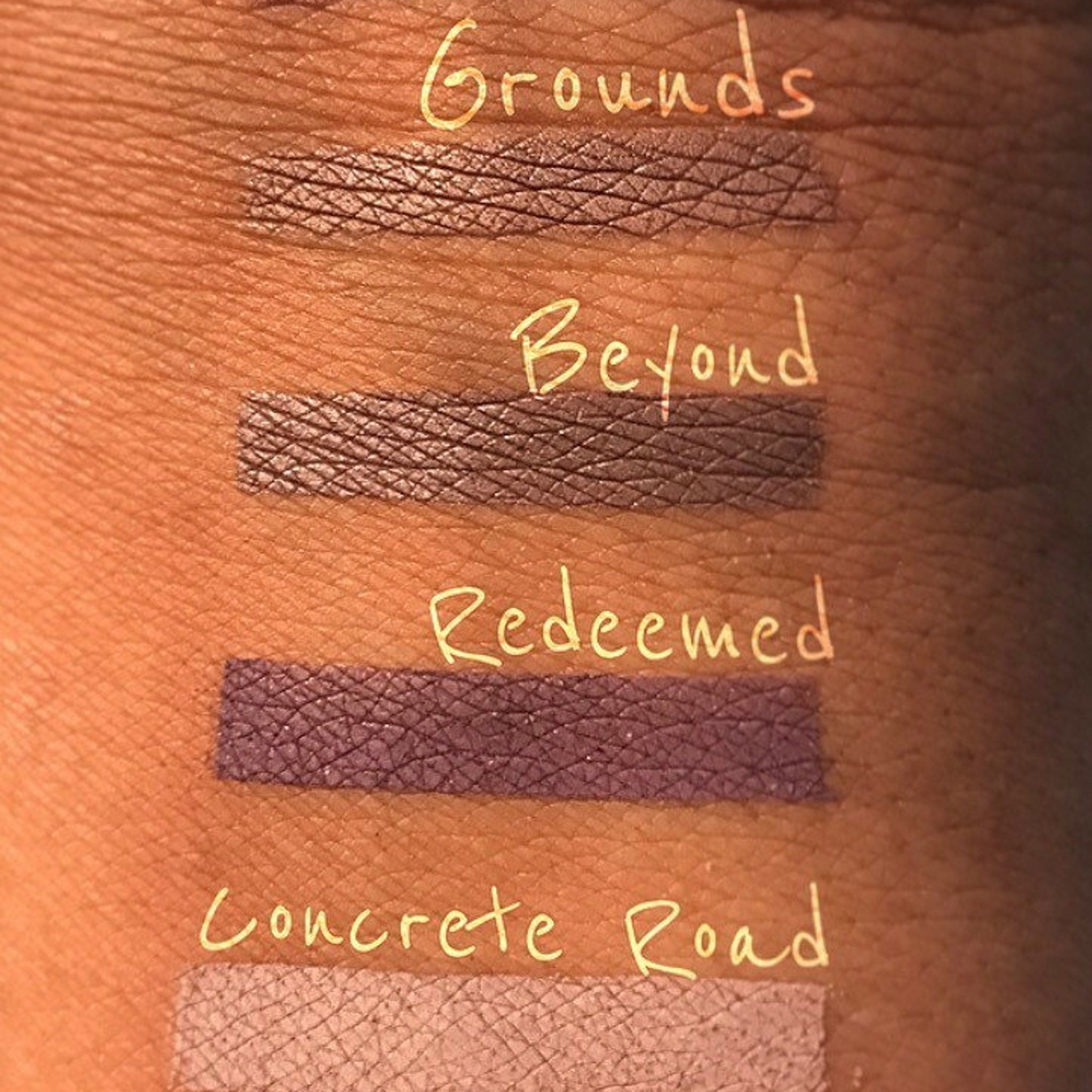 Side view of Eastern Rise matte eyeshadow pan showing smooth pressed powder texture in a 26mm round compact