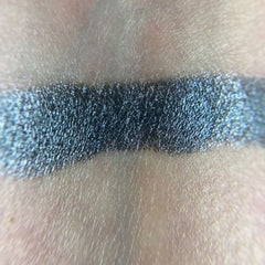Side view of Demogorgon Eye Shadow Palette showcasing twelve vibrant matte and shimmer shades in sleek black packaging