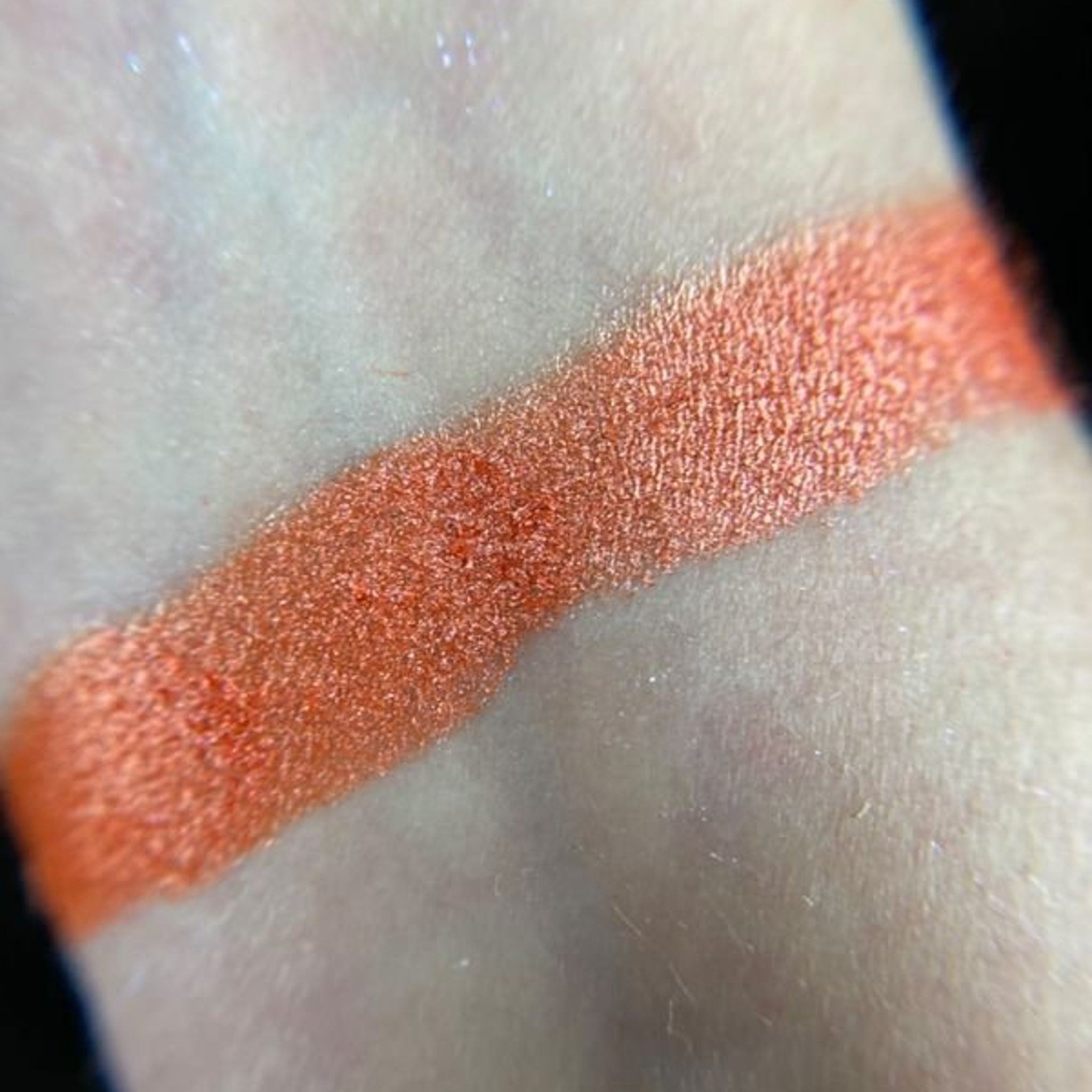 Close-up of Dear Johnny Eye Shadow palette showing shimmering bronze and taupe powder textures with smooth blendable finish
