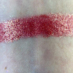 Side view of M80 Elegant Eyeshadow Palette showcasing shimmering bronze and mauve shades in sleek black compact