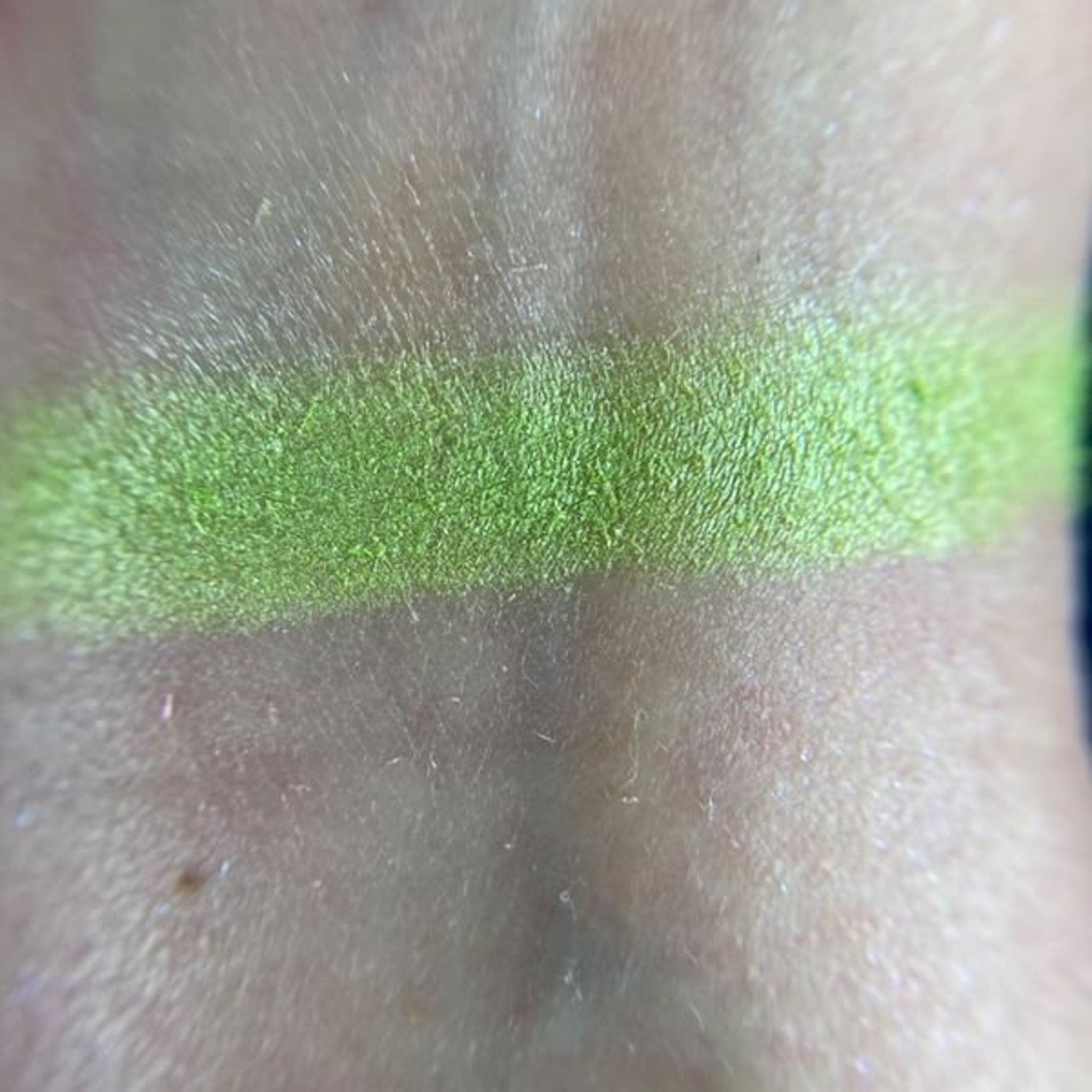 Side view of soup-inspired eyeshadow palette showcasing vibrant matte and shimmer shades in circular pans.