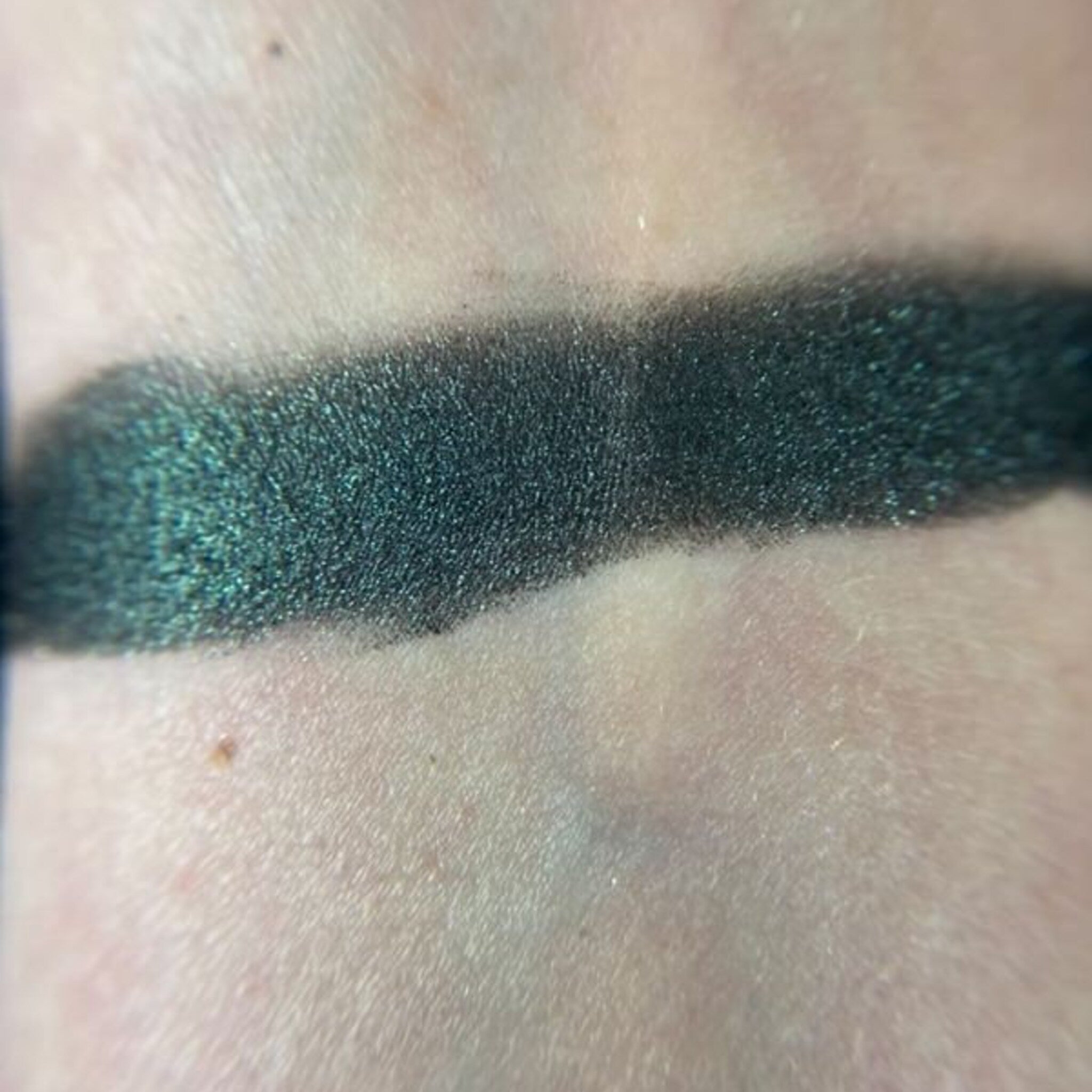 Side view of Three Times Three Eye Shadow Palette showing nine square pans with shimmer and matte finishes in neutral tones