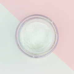 Opalescent loose pigment eyeshadow in shifting honeydew and lilac tones with sparkling multichrome finish