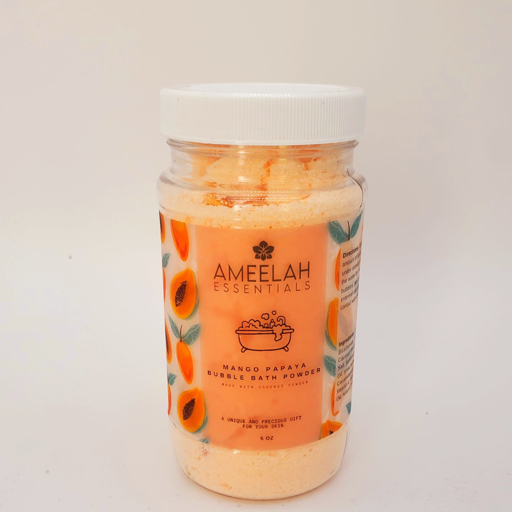 Bubble bath powder in a clear jar with white lid, orange label, and Ameelah Essentials brand text