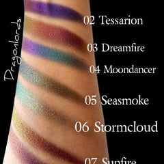 Eyeshadow swatches with metallic finish in purple, green, and brown colors on skin, Dragonlords text visible
