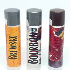 Lip balms with gray caps, colorful labels, and Lickerlips text