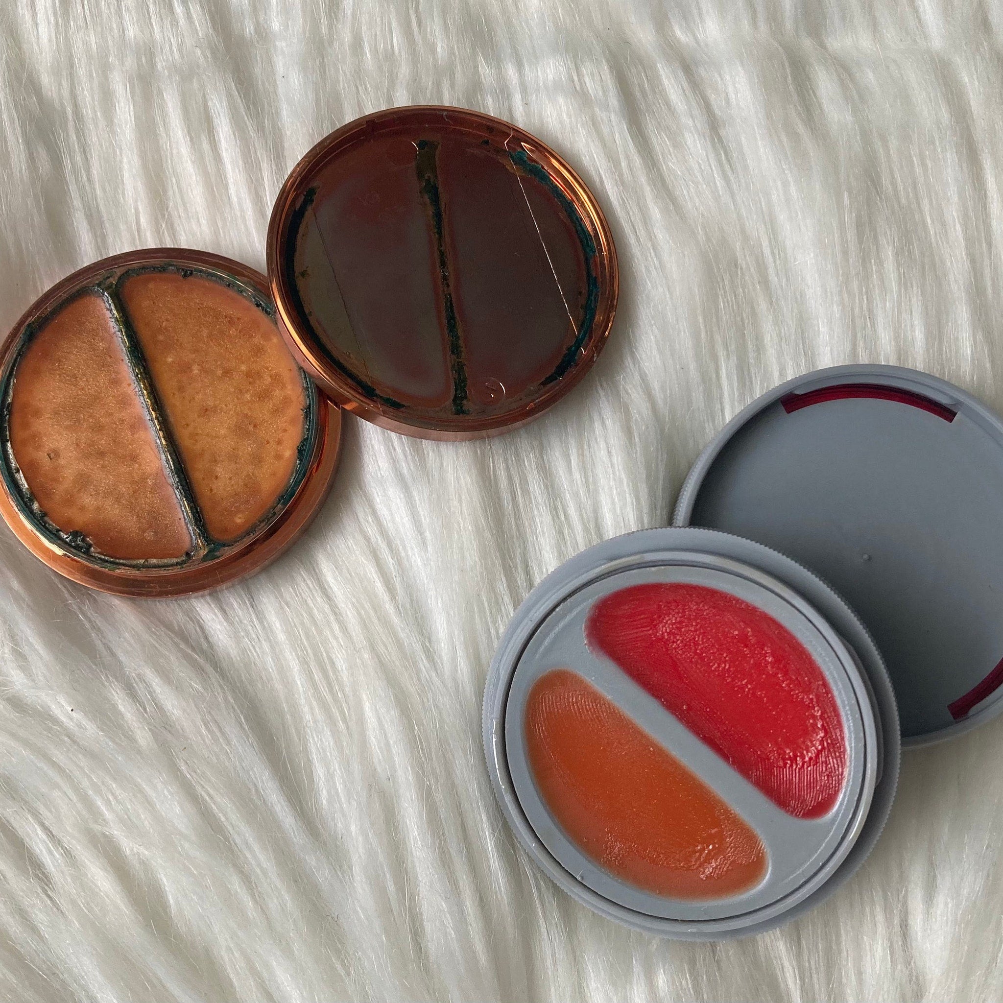 Side view of vintage 70s Avon collectible compact showing glossy lip balm texture and retro floral case design