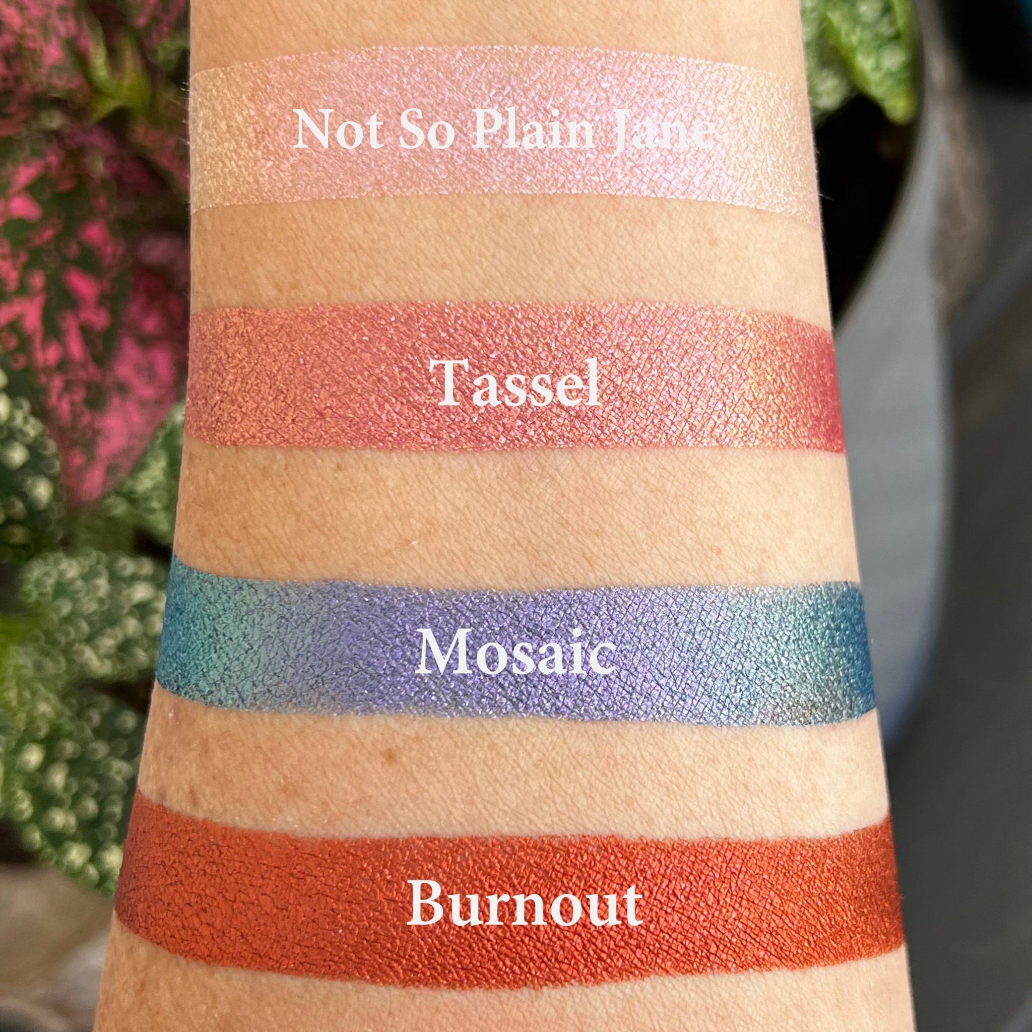 Eye shadow swatches with pink, orange, blue, and red metallic shades, TASSEL brand text visible