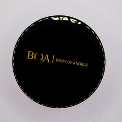 Black round compact with gold text "BOA Body of Angels" and white trim detail
