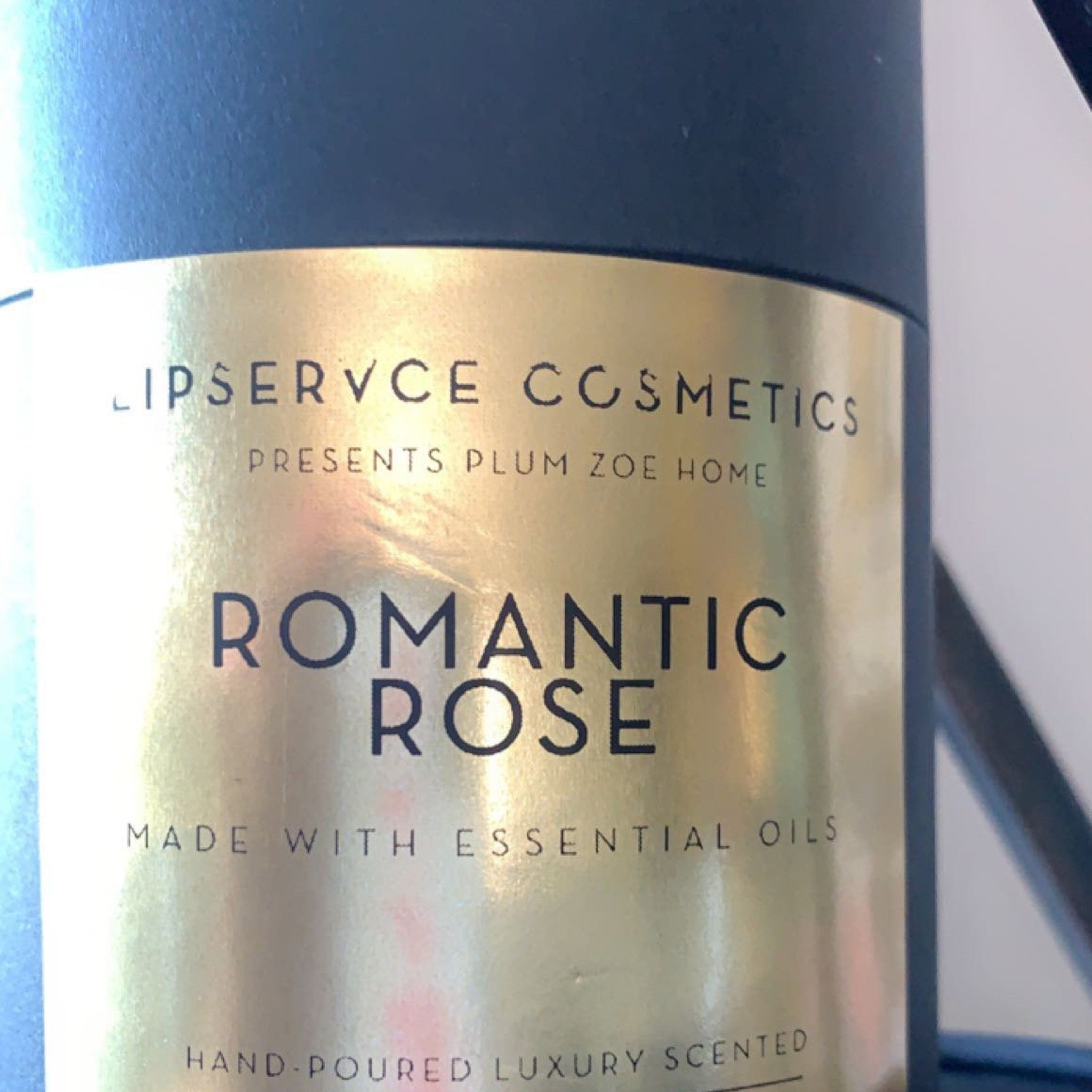 Romantic Rose label with gold and black color scheme, LIPSERVCE COSMETICS brand name visible