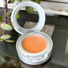 Close-up of matte vegan eyeshadow compact showing smooth pressed powder texture in neutral monk shade