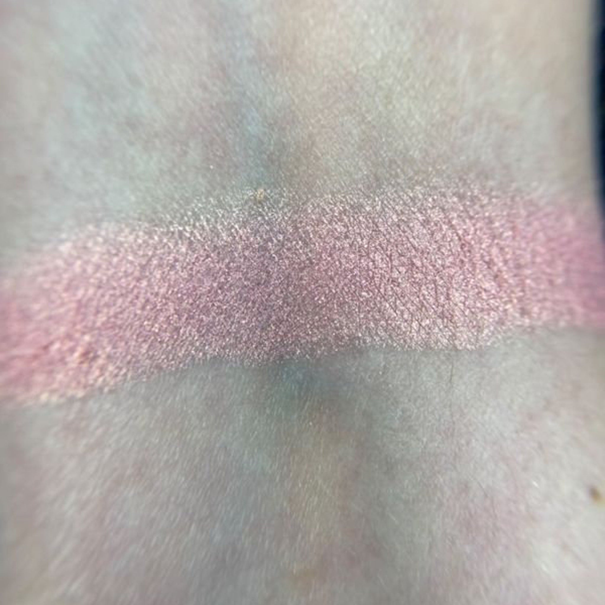 Close-up of Petal Soft Eye Shadow pan showing smooth matte pink powder with subtle shimmer particles