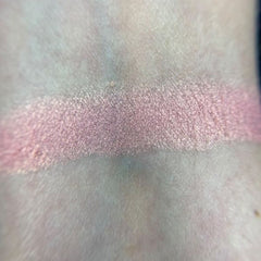 Close-up of Petal Soft Eye Shadow pan showing smooth matte pink powder with subtle shimmer particles