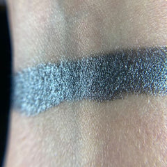 Close-up of Demogorgon Eye Shadow Palette showing vibrant matte and shimmer shades in warm bronze tones