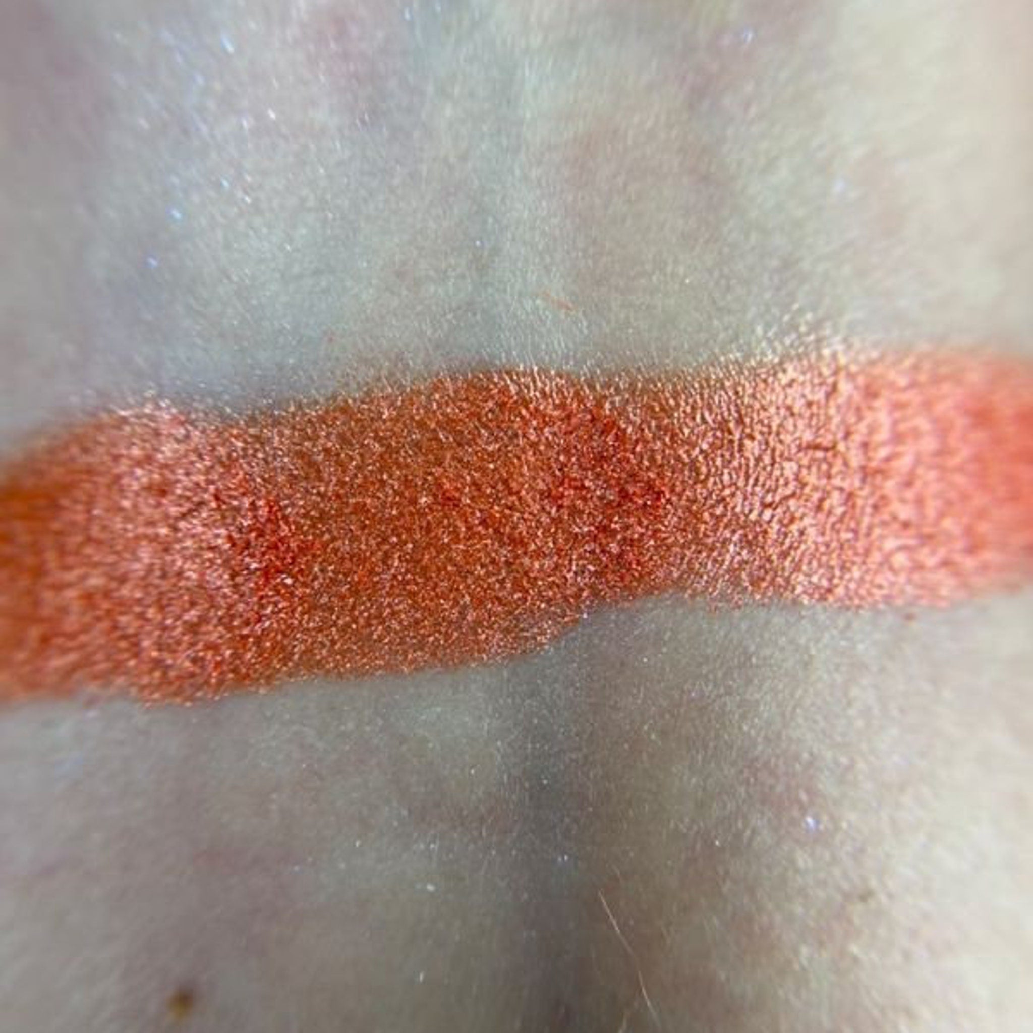 Woman applying Dear Johnny Eye Shadow with a blending brush for a smooth, shimmery finish on eyelid