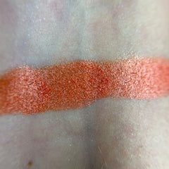 Woman applying Dear Johnny Eye Shadow with a blending brush for a smooth, shimmery finish on eyelid