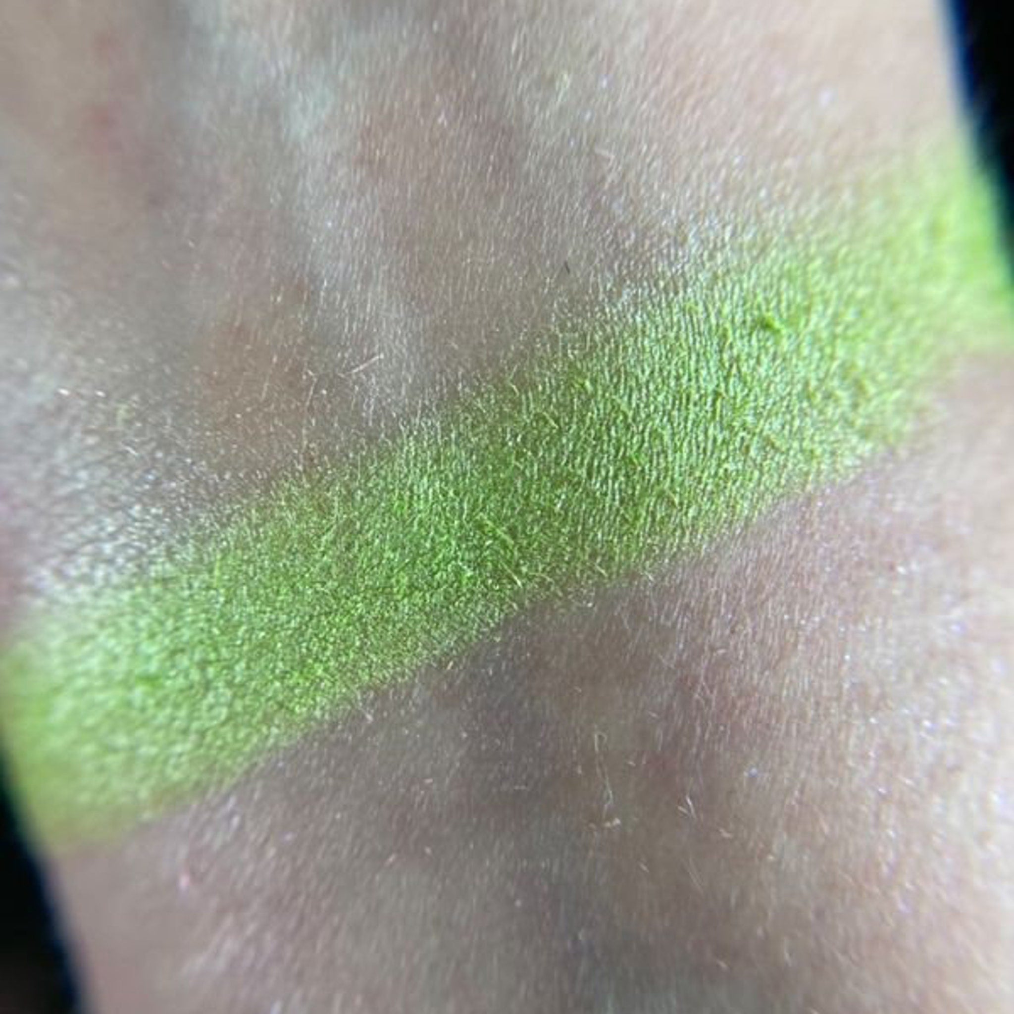 Close-up of vibrant soup-inspired eyeshadow palette showing rich matte and shimmer shades in warm tones