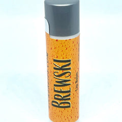 Lip balm tube with orange pattern, gray cap, and BREWSKI text label