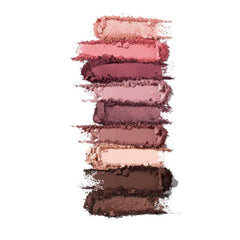 Woman applying soft pink Vintage Rose 9V eye shadow with a fluffy brush for a blended eyelid look
