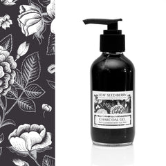 Facial cleanser bottle with black liquid, pump, and white label, Leaf Seed Berry brand