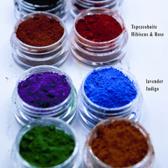 Pigment powders in clear jars, various colors, My Fathers Garden label visible