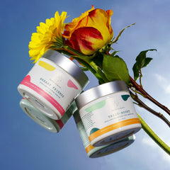 Breast cream jars with white labels, silver lids, and colorful accents, EatUP Original brand