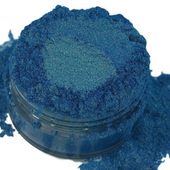 Metallic blue gold eyeshadow pot with iridescent mermaid shimmer and smooth mineral texture