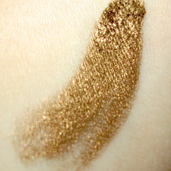 Close-up of Carmen Mineral Pigment Eye Shadow showing finely milled powder texture in a vibrant jewel-toned shade