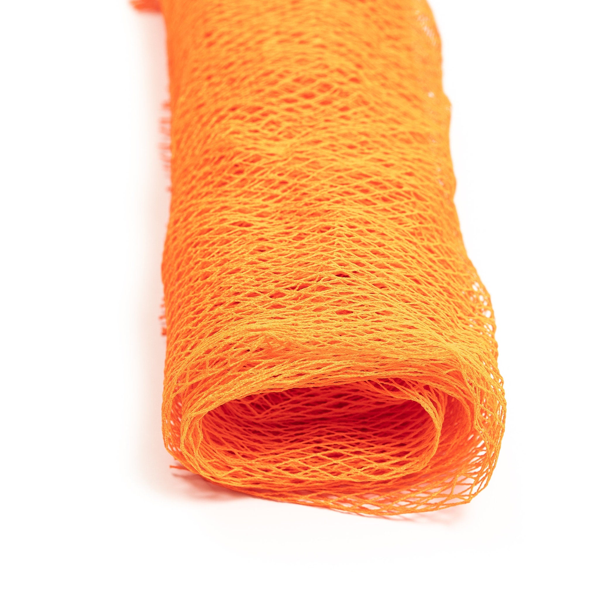 Orange mesh netting rolled up, showing woven pattern and bright color.