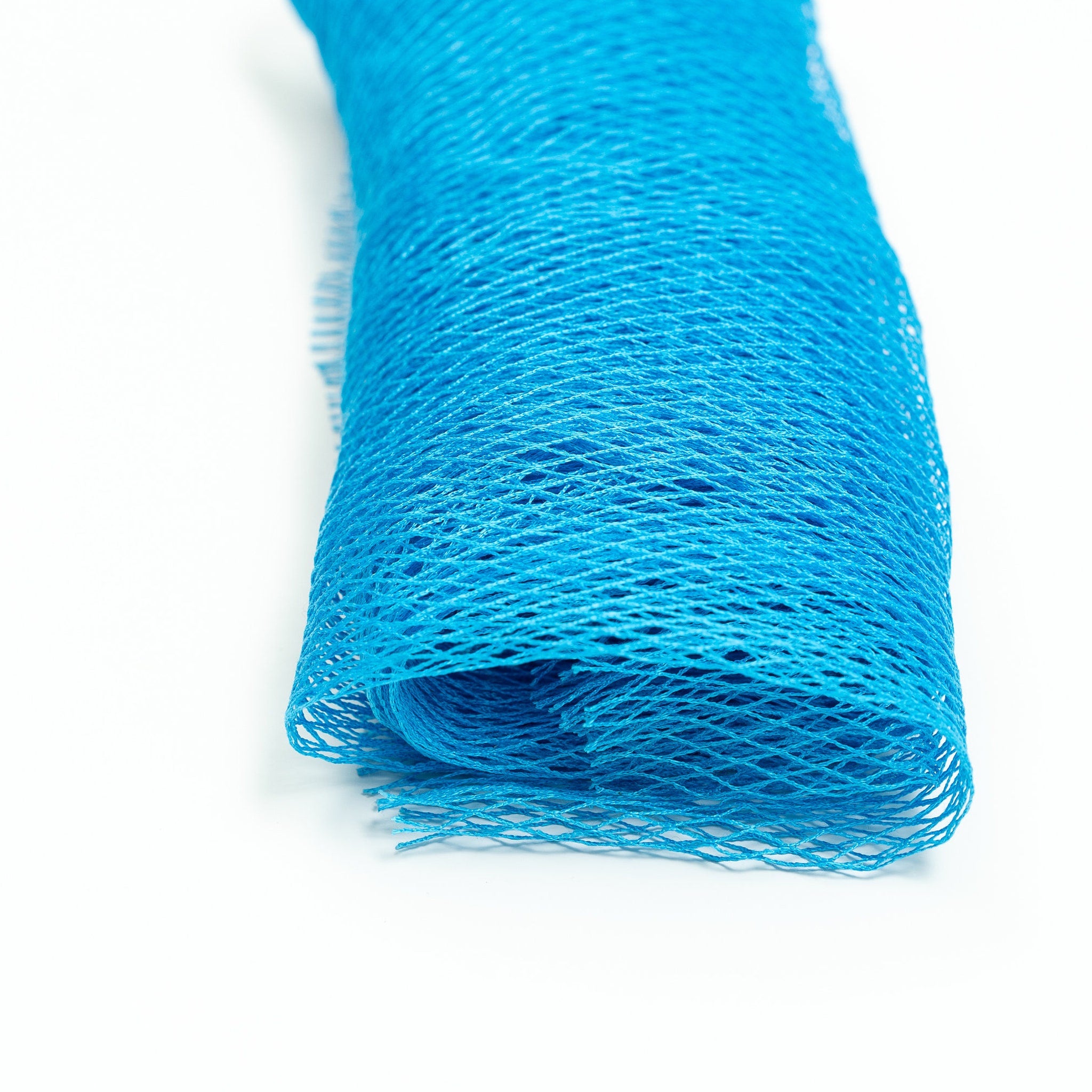 Blue mesh material with open weave, rolled up on white background