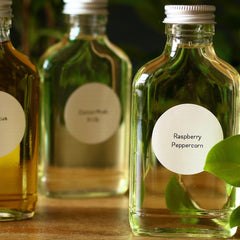 Reed diffuser refill bottles, clear glass, silver cap, with labels
