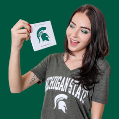 Side view of Michigan State University green and white eye shadow palette with matte and shimmer finishes