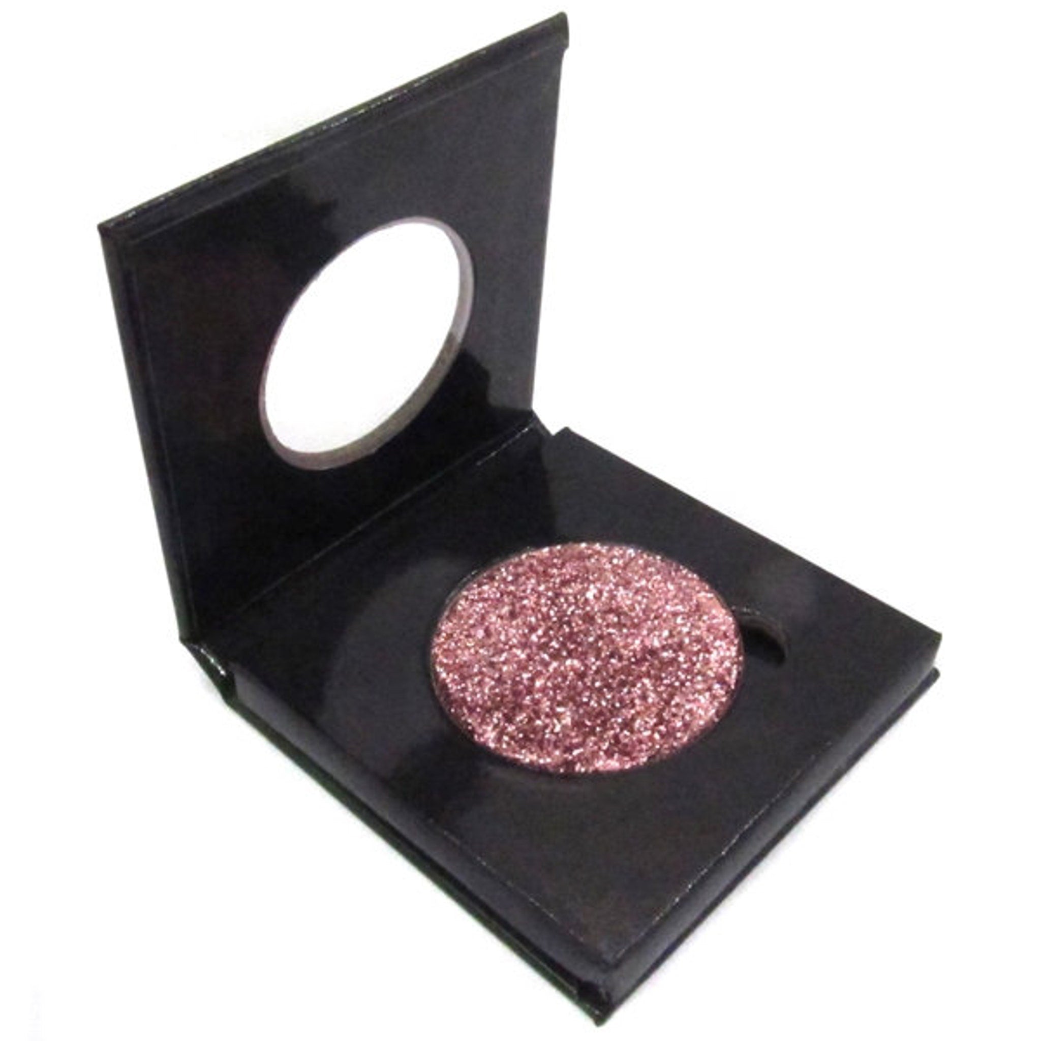 Square compact with reflective silver casing holding Chromalight pressed glitter eye shadow for a radiant glow