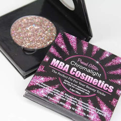 Close-up of fingertips applying shimmery Chromalight pressed glitter eyeshadow to eyelid for radiant glow
