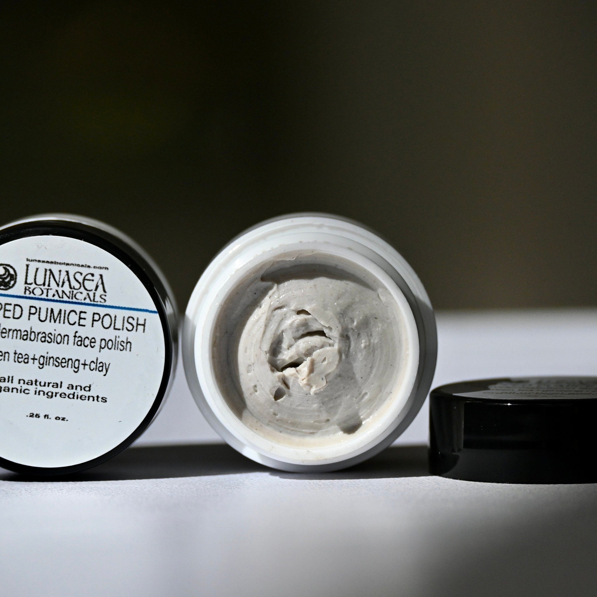 Pumice polish with visible LunaSea Botanicals branding, light gray color, and open jar with product visible